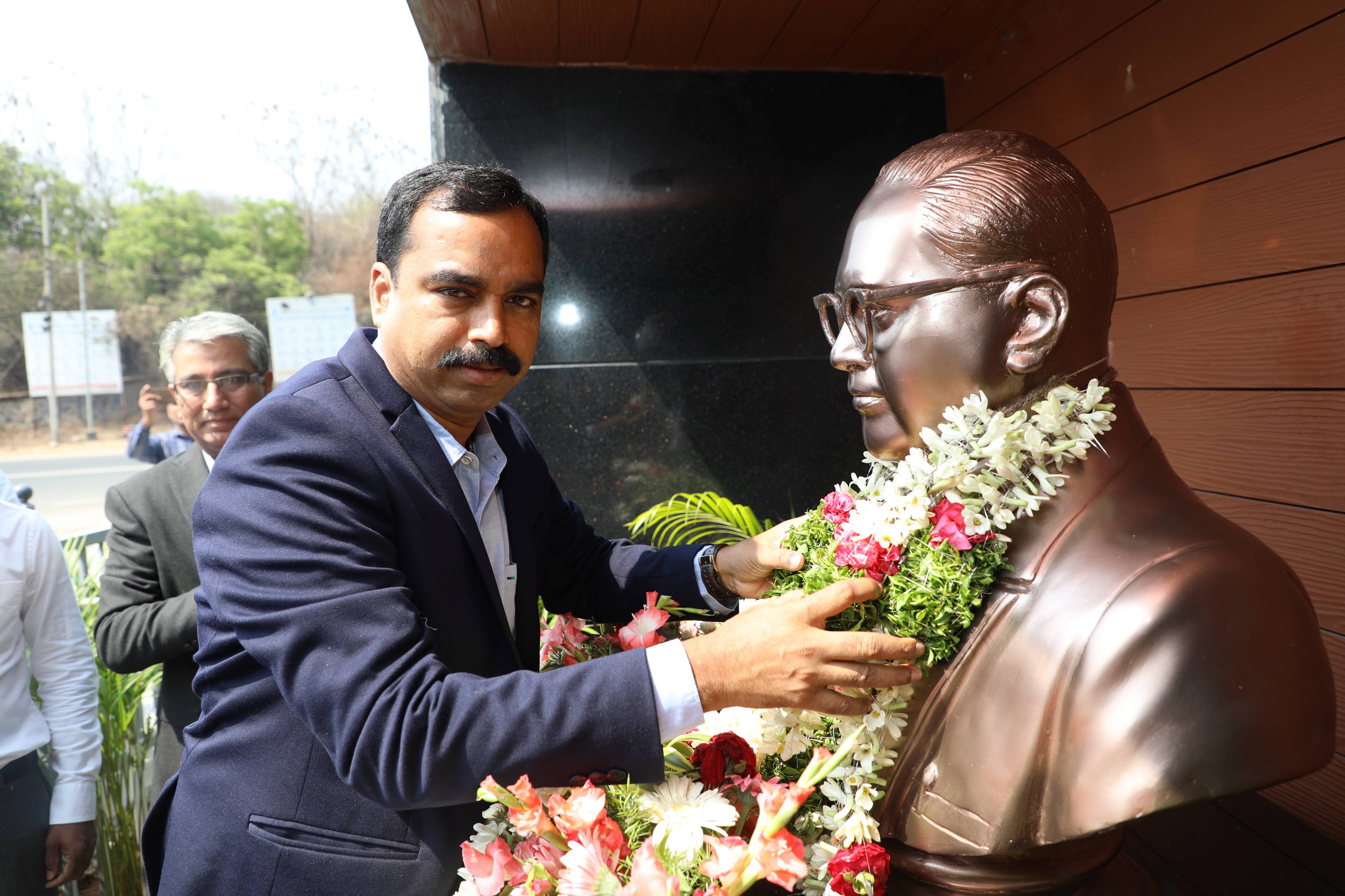 Professor Dr. G. Mallesham, Dean, Development & UGC affairs, Osmania University Paying Tributes to Dr. B.R. Ambedkar by garlanding statue at NFC Main Gate. 