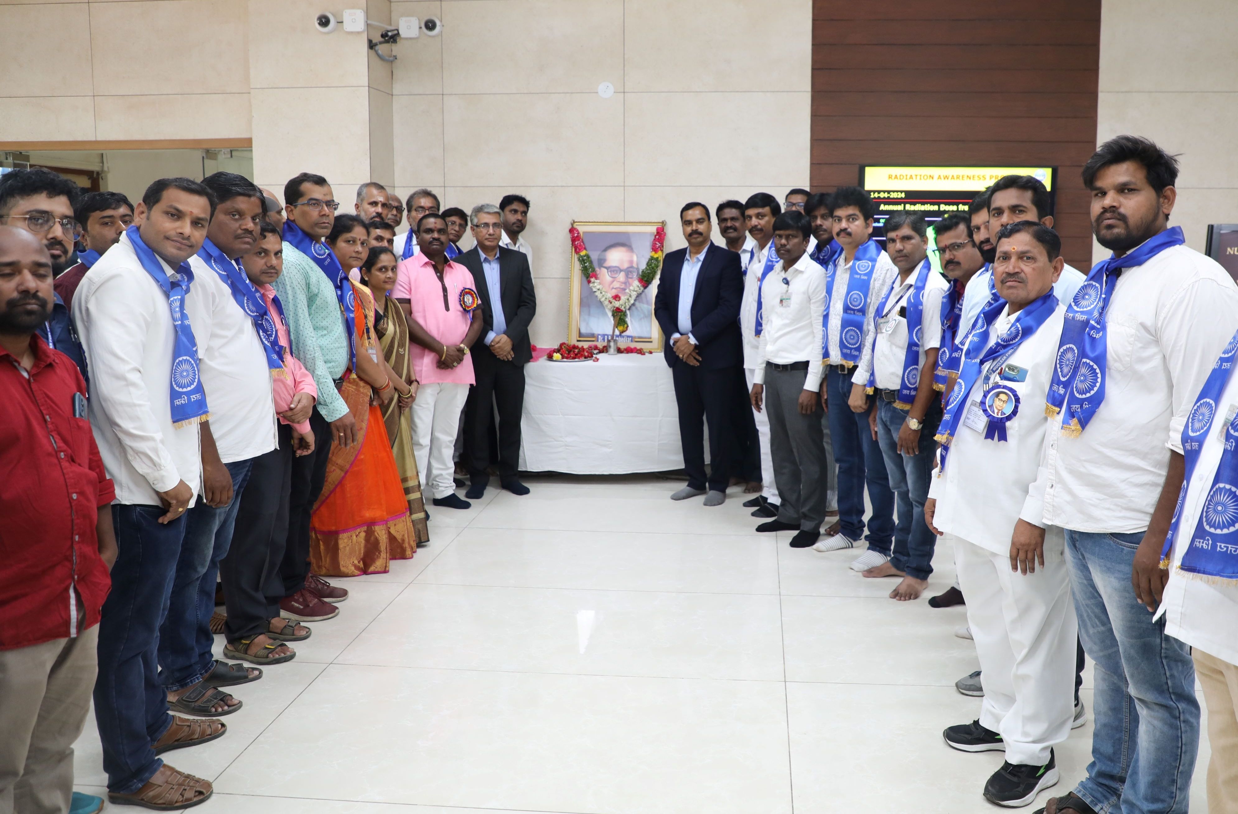 Chief Guest and Guest of Honour Paying Tributes to Dr.B.R. Ambedkar portrait. 
