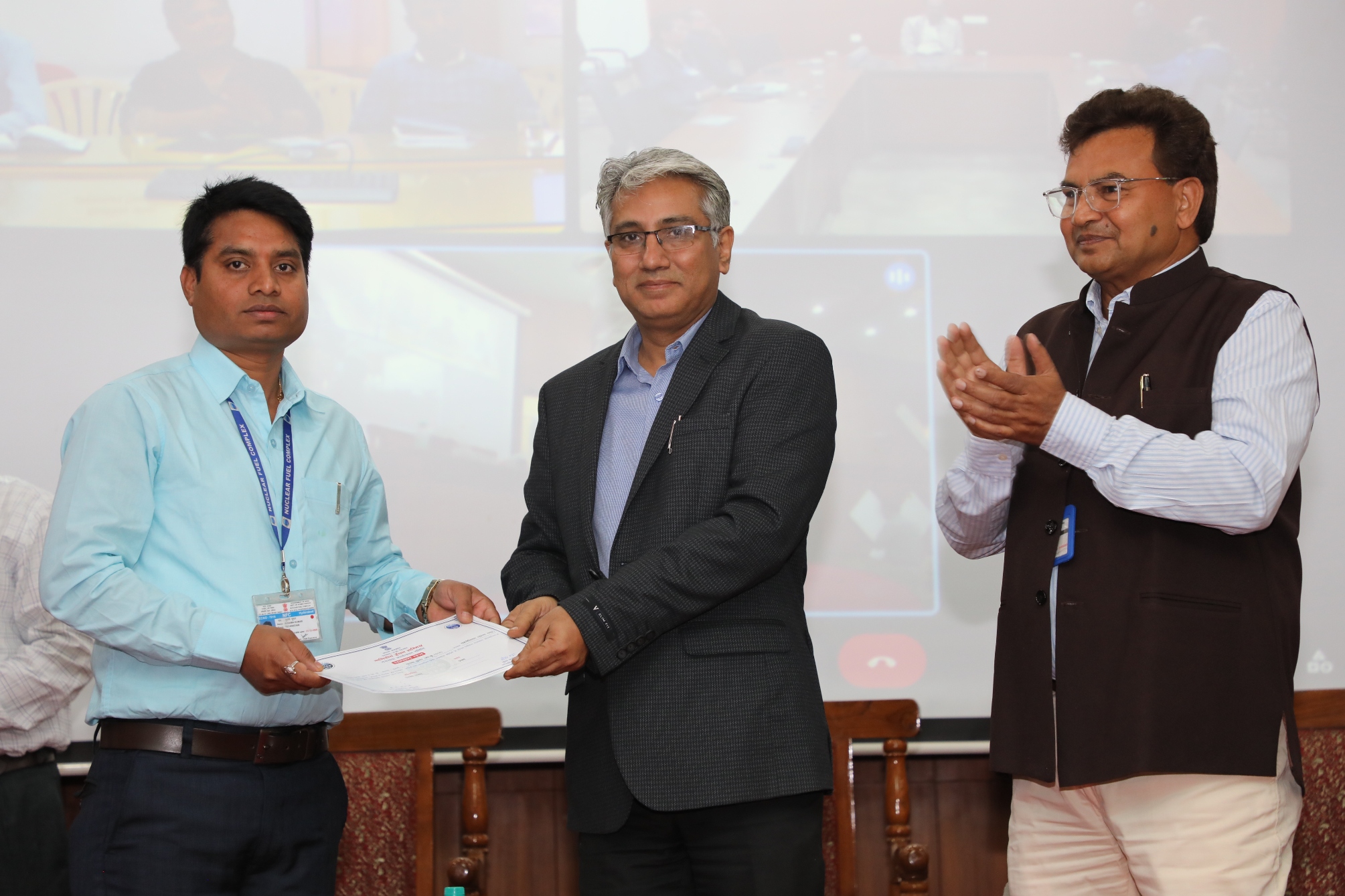 Officials receiving various Hindi competitions prizes from the hands of Chief Executive, NFC.