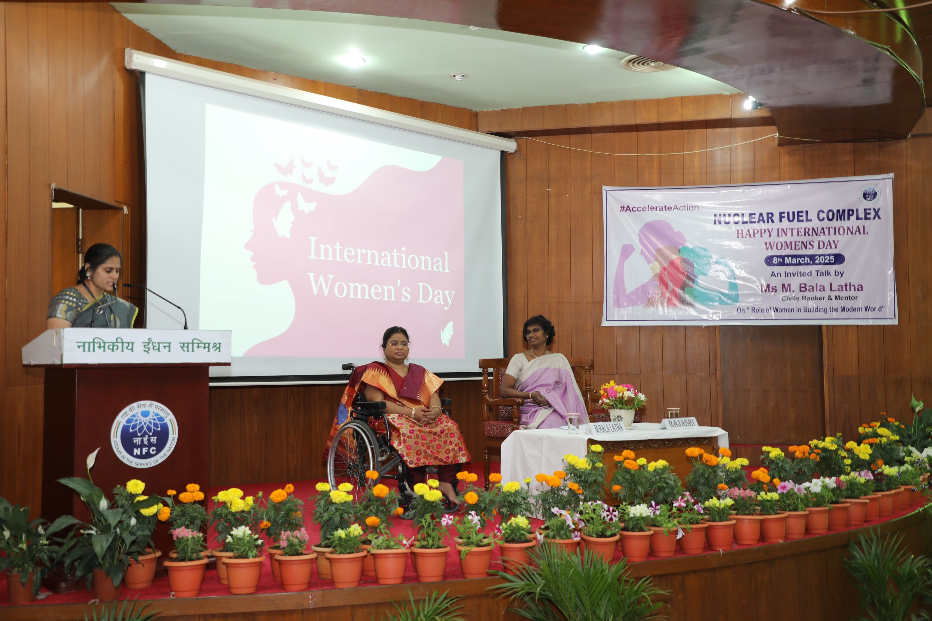 Dignitaries on stage for International Women’s Day celebrations, 2025.