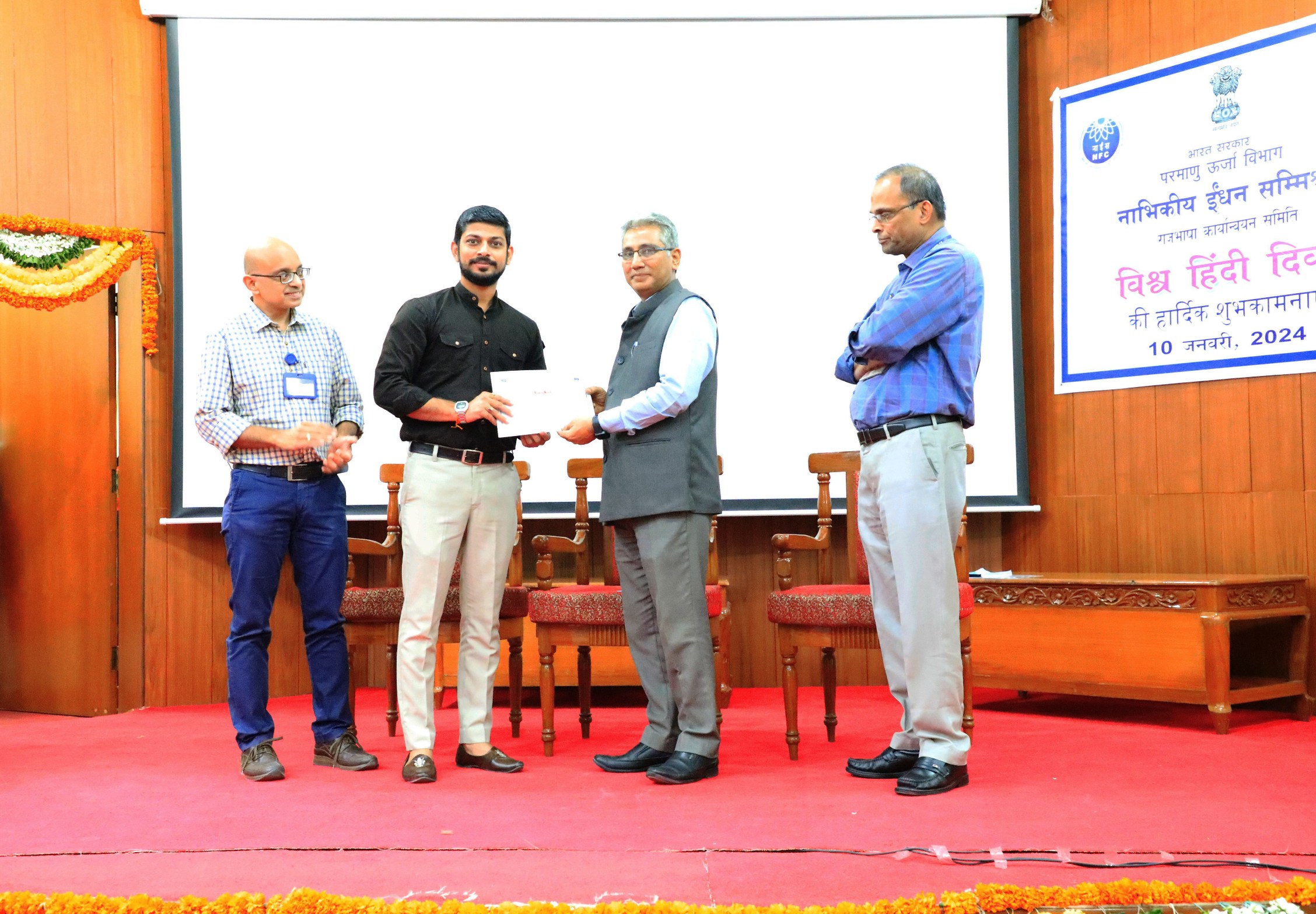  Officials receiving various Official Language competitions prizes by Chief Executive, NFC.