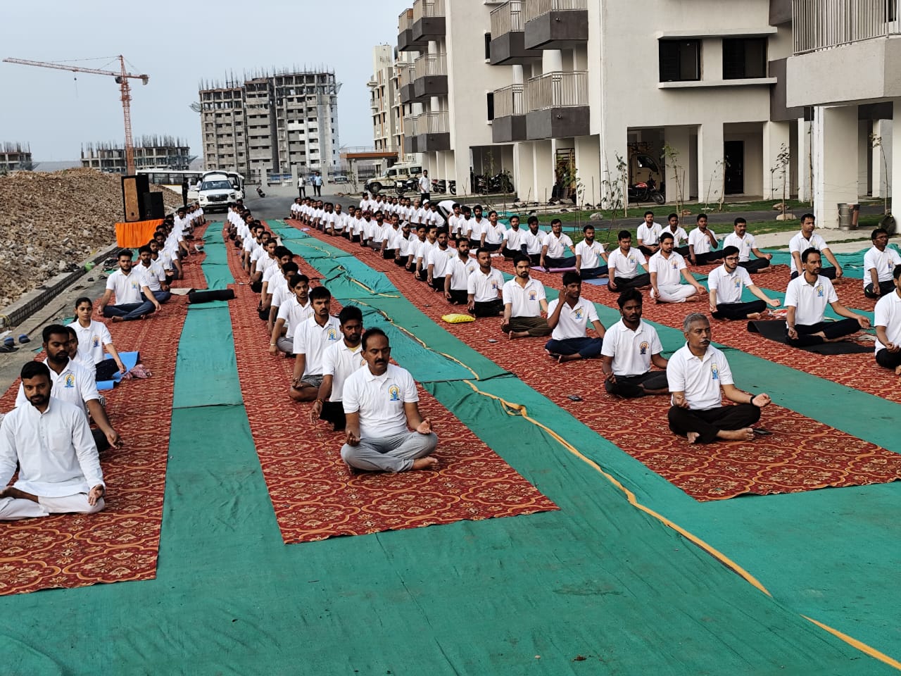 Performing yoga practice by gathering at NFC-Kota. 
